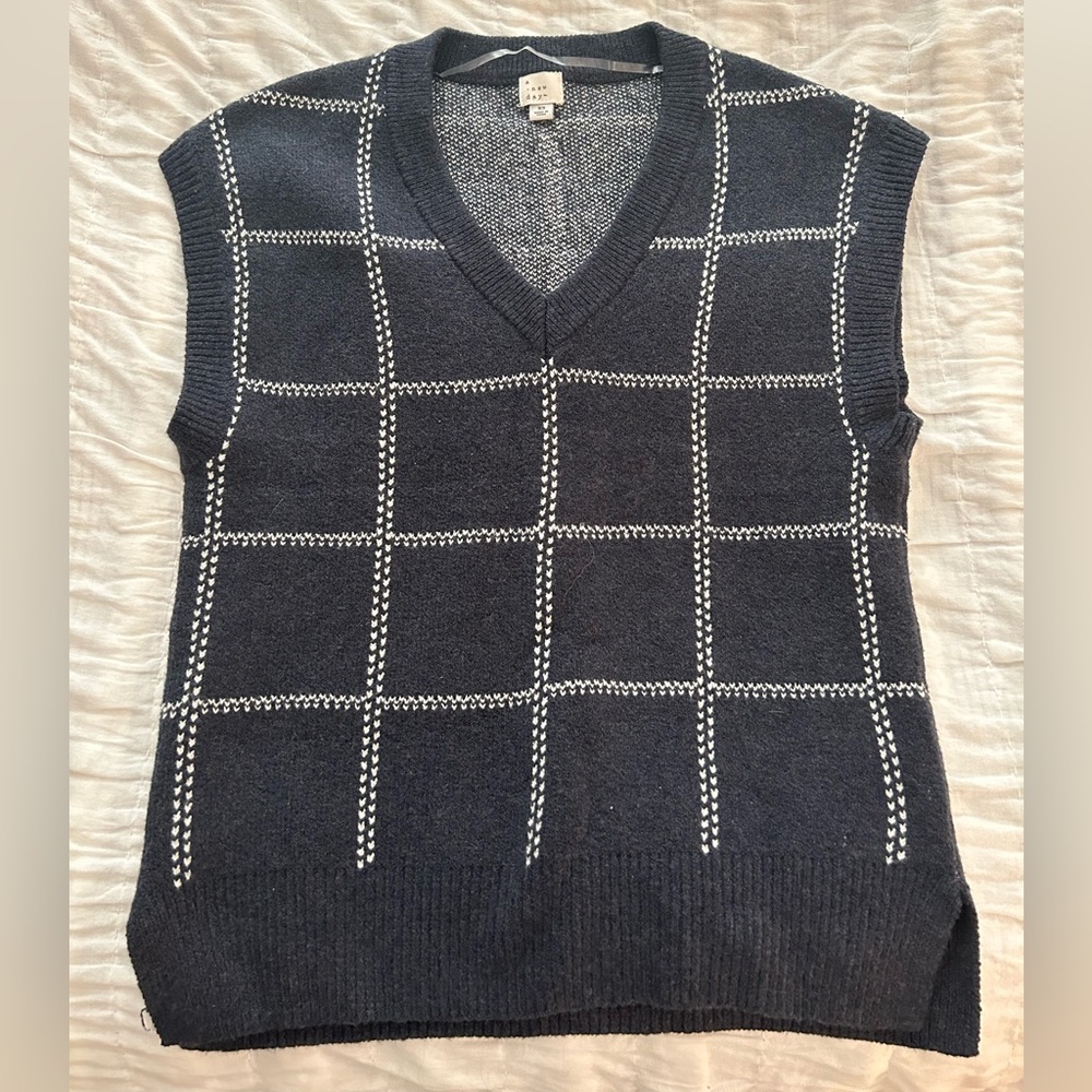 a new day sweater vest